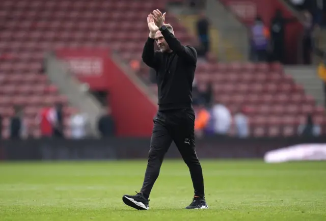 Simon Rusk applauds the fans at St Mary's