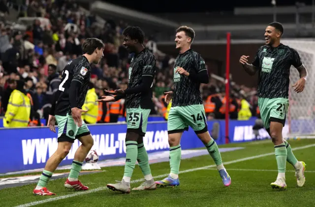 Sheffield United players celebrate the second goal of the 2-0 win at Stoke