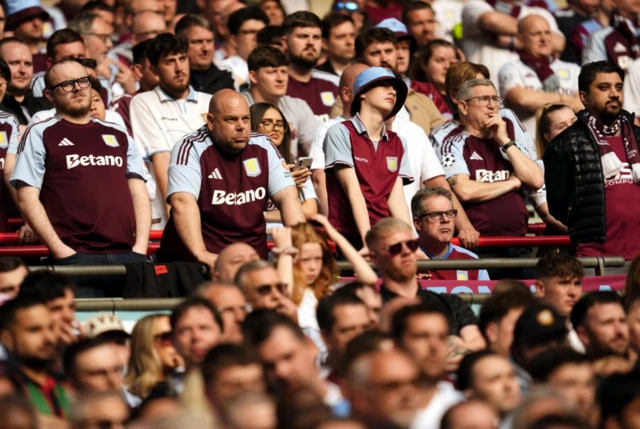 Aston Villa fans in the stands react