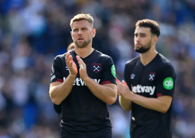 West Ham players applaud at full time