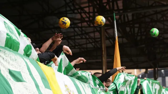 Celtic fans throw on balls