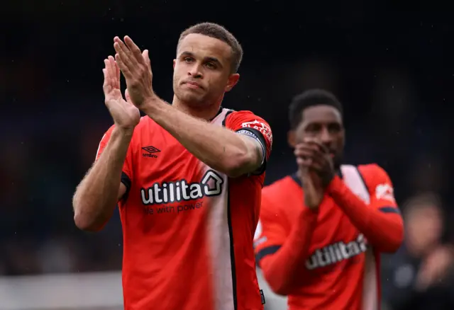 Luton captain Carlton Morris claps the fans after the 3-1 win over Bristol City