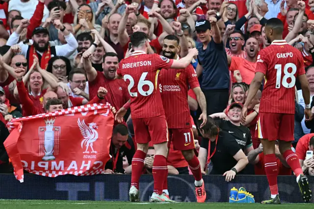 Mohamed Salah (C) celebrates with teammates