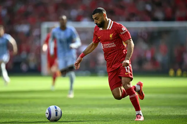 Mohamed Salah runs with the ball