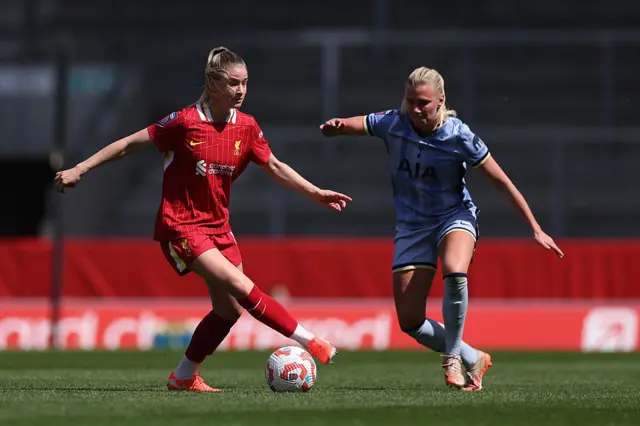 Marie Hobinger of Liverpool controls the ball whilst under pressure from Josefine Rybrink of Tottenham Hotspur during the Barclays Women's Super League match between Liverpool FC and Tottenham Hotspur FC at the Totally Wicked Stadium on April 27, 2025