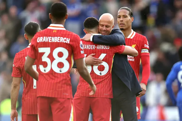 Liverpool manager Arne Slot hugs Trent Alexander-Arnold