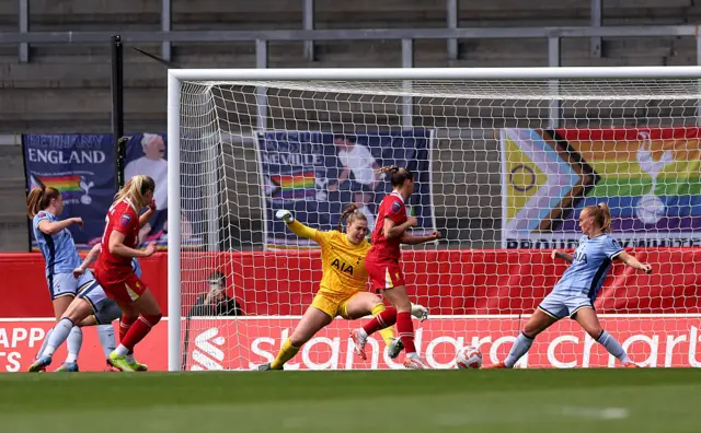 Lize Kop of Totenham Hotspur fails to save a shot from Sophie Roman Haug of Liverpool as she scores her team's first goal during the Barclays Women's Super League match between Liverpool FC and Tottenham Hotspur FC at the Totally Wicked Stadium on April 27, 2025 in Liverpool, England.