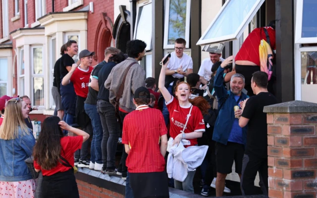 Liverpool fans celebrate outside the stadium