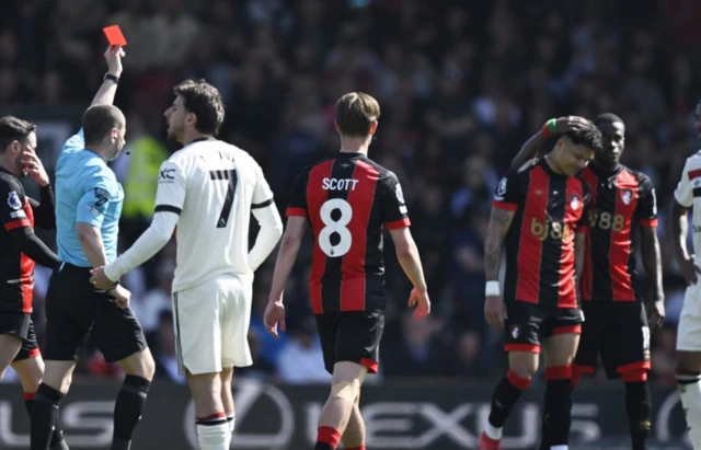 AFC Bournemouth's Evanilson is shown a red card