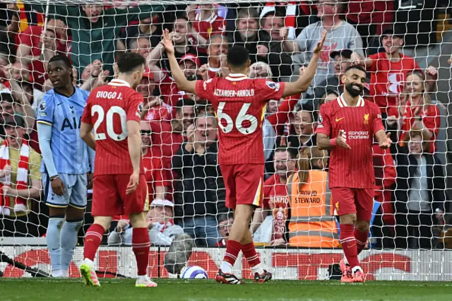 Mohamed Salah (R) reacts