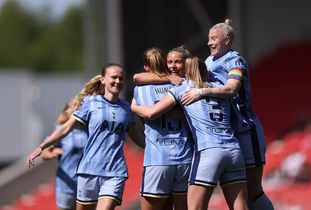 Clare Hunt of Tottenham Hotspur celebrates scoring her team's second goal with teammates during the Barclays Women's Super League match between Liverpool FC and Tottenham Hotspur FC at the Totally Wicked Stadium on April 27, 2025 in Liverpool, England.