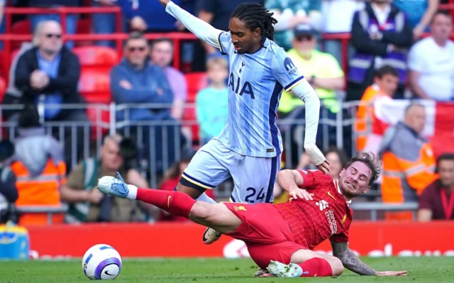 Liverpool's Alexis Mac Allister (right) challenges Tottenham Hotspur's Djed Spence