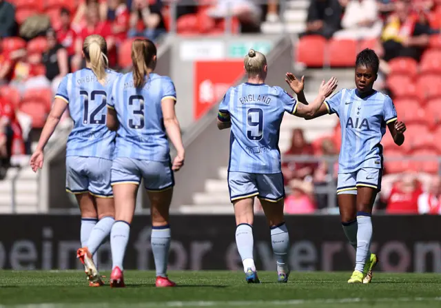 Jessica Naz and Bethany England of Tottenham Hotspur celebrate own goal scored by Rachael Laws of Liverpool (not pictured) during the Barclays Women's Super League match between Liverpool FC and Tottenham Hotspur FC