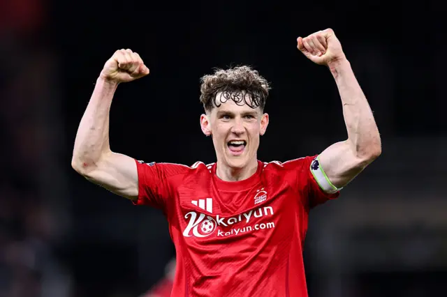 Ryan Yates holds his arms up in the air