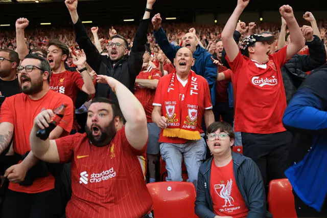 Fans of Liverpool celebrate after Alexis Mac Allister