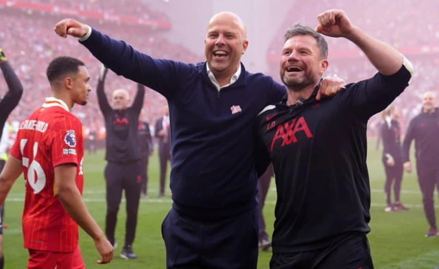 Liverpool manager Arne Slot (left) and head of rehab physiotherapy Lee Nobes celebrate