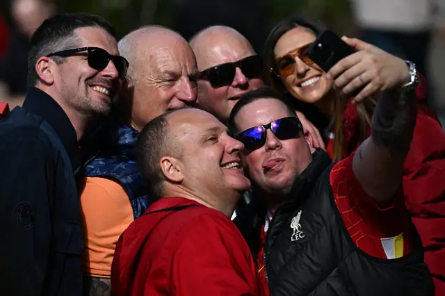 Liverpool fans pose for a selfie photo