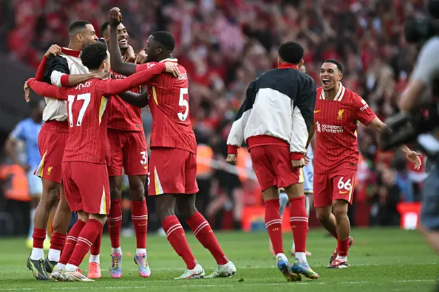 Liverpool players celebrate on the final whistle