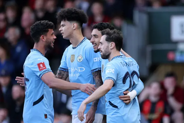 Manchester City players celebrate after scoring against Bournemouth in the FA Cup quarter-finals