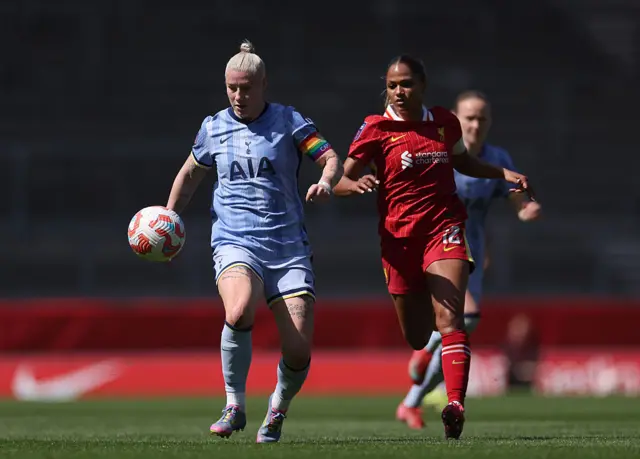 Bethany England of Tottenham Hotspur controls the ball whilst under pressure from Taylor Hinds of Liverpool during the Barclays Women's Super League match between Liverpool FC and Tottenham Hotspur FC at the Totally Wicked Stadium on April 27, 2025 in Liverpool, England.