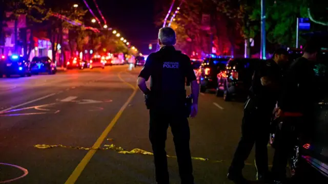 Police work on Fraser street, near the site of the Lapu Lapu day block party where a vehicle drove into a crowd killing several people in Vancouver, British Columbia