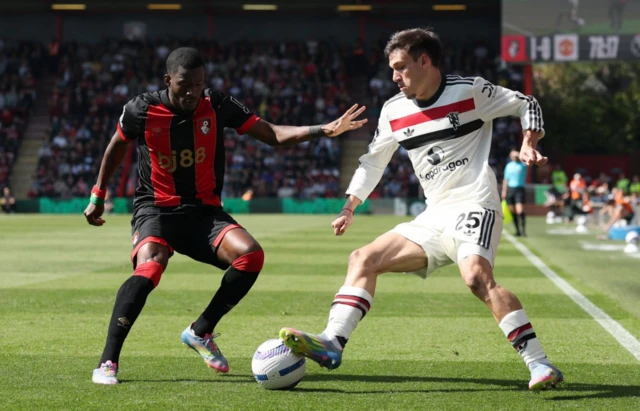 AFC Bournemouth's Dango Ouattara in action with Manuel Ugarte