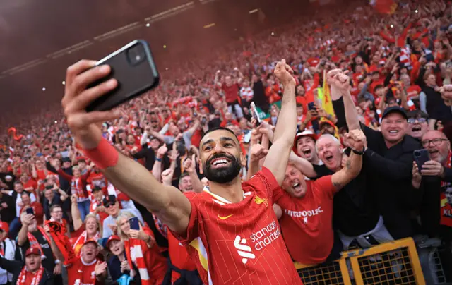 Mohamed Salah of Liverpool takes a selfie with the fans