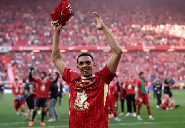 Trent Alexander-Arnold of Liverpool celebrates the teams victory and confirmation of winning the Premier League title after the Premier League match between Liverpool FC and Tottenham Hotspur FC at Anfield.