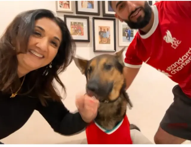 Liverpool fans with their dog