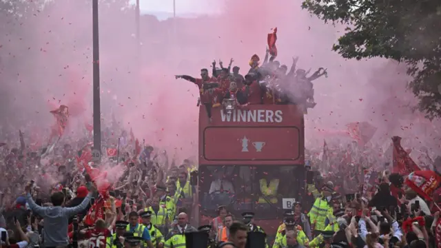 Liverpool celebrating their FA Cup and Carabao Cup win