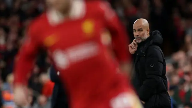 Pep Guardiola on the touchline at Anfield