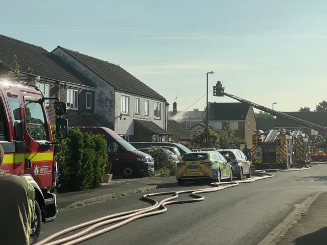 Fire engines hosing down a house in Lancaster Road, Yate