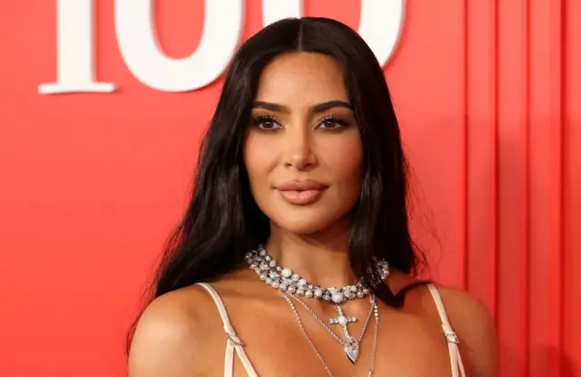 Kim Kardashian poses on the red carpet