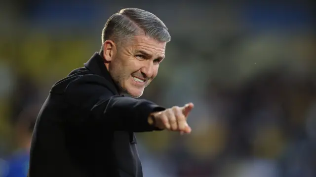 Ryan Lowe grimaces as he points his team forward