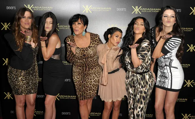 The Kardashian sisters and their mum blowing a kiss to the camera