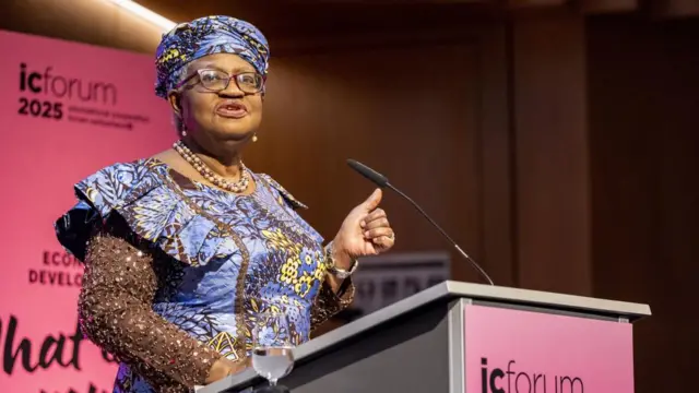 World Trade Organization (WTO) Director-General Ngozi Okonjo-Iweala speaks behind podium.