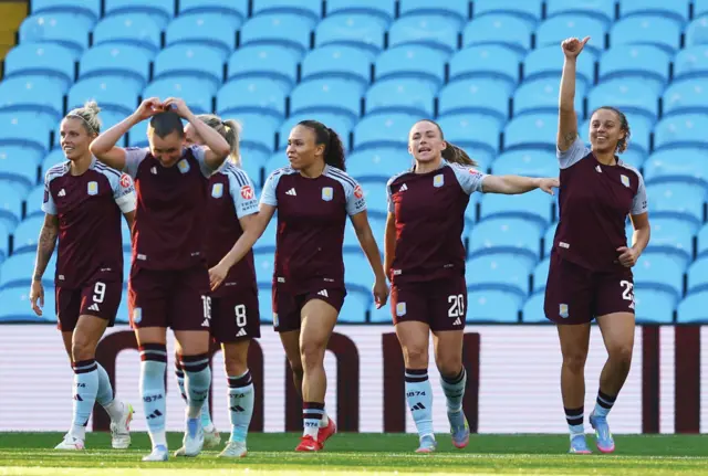 Aston Villa's Chasity Grant celebrates scoring their third goal with teammates