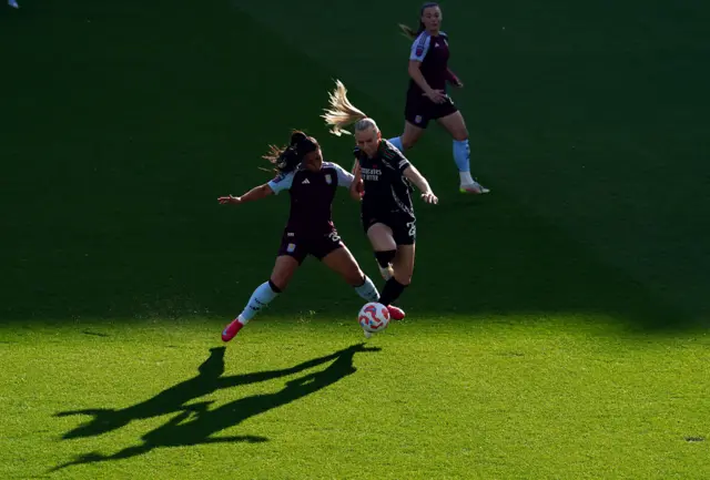 Arsenal's Stina Blackstenius and Aston Villa's Maz Pacheco (left) during the Barclays Women's Super League match at Villa Park, Birmingham.