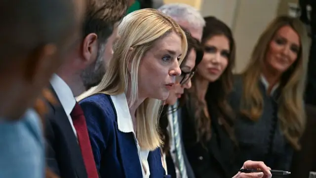Bondi speaking as people around the table watch her