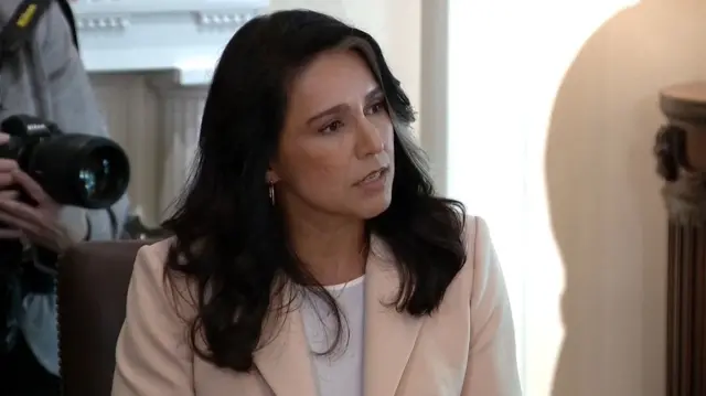 Gabbard speaking as she looks to her side
