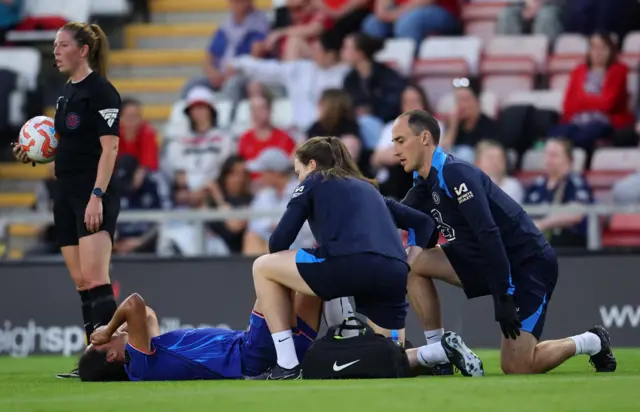Ramirez is tended to by two physios after picking up an injury