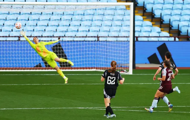 Aston Villa's Kirsty Hanson scores their second goal past Arsenal's Manuela Zinsberger