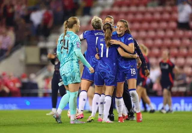 Hannah Hampton, Millie Bright, Guro Reiten and Wieke Kaptein of Chelsea celebrate victory and winning the Barclays WSL title following the Barclays Women's Super League match between Manchester United FC and Chelsea FC at Leigh Sports Village