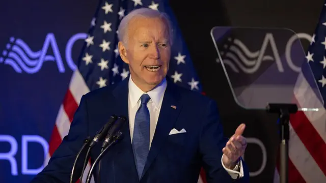 Joe Biden speaking at a dais