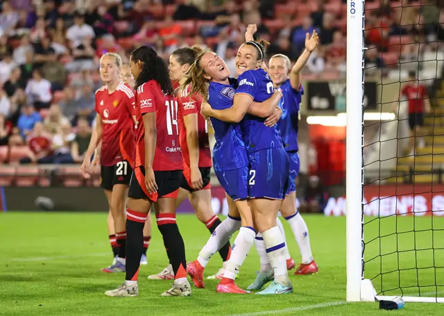 Bronze celebrates her goal with Kaptein and Beever-Jones