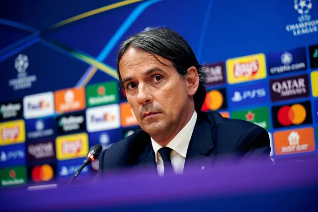 Inter Milan boss Simone Inzaghi sat at a news conference desk
