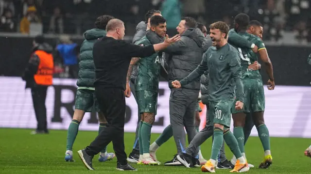 Ange Postecoglou of Tottenham Hotspur and James Maddison of Tottenham Hotspur with post game celebration during the Europa League Quarter Final match between Eintracht Frankfurt and Tottenham at the Deutsche Bank Park, Frankfurt, Germany, on April 17, 2025.