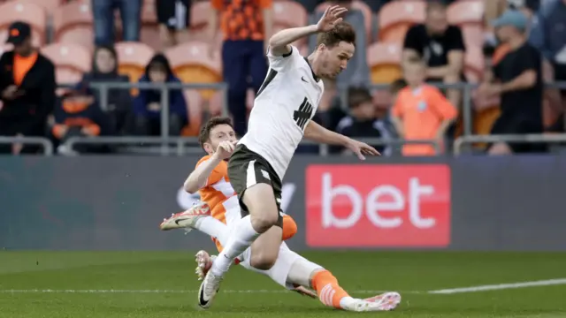 James Husband of Blackpool challenges Kieran Dowell of Birmingham City