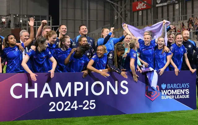Players of Chelsea celebrate victory and winning the Barclays WSL title following the Barclays Women's Super League match between Manchester United FC and Chelsea FC at Leigh Sports Village on April 30, 2025 in Leigh, England.