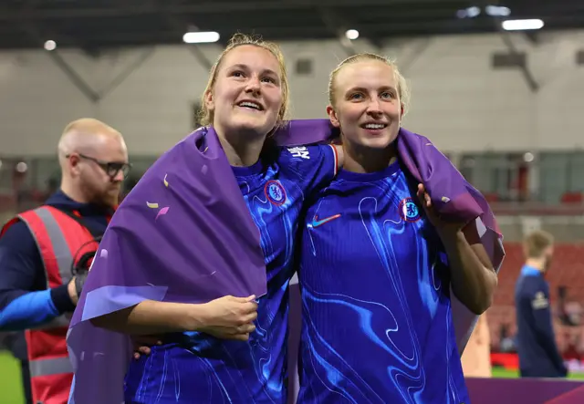 Wieke Kaptein and Aggie Beever-Jones of Chelsea celebrate victory and winning the Barclays WSL title following the Barclays Women's Super League match between Manchester United FC and Chelsea FC at Leigh Sports Village on April 30, 2025 in Leigh, England